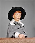 1960s SERIOUS BOY DRESSED IN PILGRIM CLOTHES COSTUME FOR THANKSGIVING SCHOOL PLAY