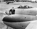 1950s FRONT OF JET AIRPLANE SLIDING COCKPIT FORWARD GUN BAY WITH DOOR OPEN ON TARMAC AT LANGLEY AIR FORCE BASE HAMPTON VA USA