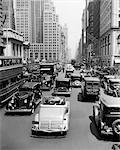 1930s CARS TRUCKS DOUBLE DECKER BUSES STREET TRAFFIC 5TH AVENUE TRAFFIC BY PUBLIC LIBRARY MANHATTAN NEW YORK CITY USA