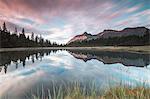 Clouds reflected in Lake Entova at dawn, Entova Alp, Malenco Valley, Sondrio province, Valtellina, Lombardy, Italy, Europe