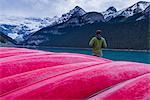 Traveler at the canoe house of Lake Louise, Banff National Park, UNESCO World Heritage Site, Canadian Rockies, Alberta, Canada, North America