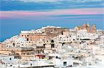 View of typical architecture and white houses of the old medieval town at sunset, Ostuni, Province of Brindisi, Apulia, Italy, Europe