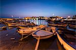 Dusk lights the harbor and the medieval old town of Gallipoli, Province of Lecce, Apulia, Italy, Europe