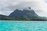 The volcanic rock in the turquoise lagoon of Bora Bora, Society Islands, French Polynesia, Pacific