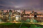 Manhattan skyline and Brooklyn Bridge, before sunrise, New York City, United States of America, North America