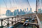 Rush hour traffic on Brooklyn Bridge and Manhattan skyline beyond, New York City, United States of America, North America