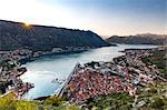 Looking over the old town of Kotor and across the Bay of Kotor viewed from the fortress at sunset, UNESCO World Heritage Site, Montenegro, Europe