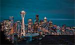 Seattle city skyline at night with urban office buildings and Space Needle viewed from garden near Kerry Park, Seattle, Washington State, United States of America, North America