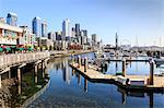 Seattle Skyline and restaurants on sunny day in Bell Harbor Marina, Seattle, Washington State, United States of America, North America