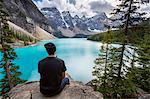 Lone traveller at Moraine Lake and the Valley of the Ten Peaks, Banff National Park, UNESCO World Heritage Site, Canadian Rockies, Alberta, Canada, North America