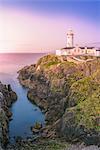 Fanad Head (Fánaid) lighthouse, County Donegal, Ulster region, Ireland, Europe. Pink sunset at Fanad Head