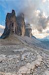 Sunset with clouds on Tre Cime di Lavaredo as seen from Lavaredo fork, Sexten Dolomites, Italy