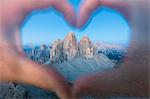 hands forming an heart framing the Tre Cime di Lavaredo, Sexten Dolomites, South Tyrol, Bolzano, Italy