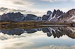 Rocky peaks reflected in Laghi Dei Piani, Dolomites, South Tyrol, province of Bolzano, Italy