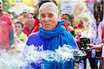 Portrait of a senior, indigenous female tribal dancer at the St Michael Archangel Festival parade in San Miguel de Allende, Mexico