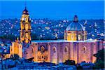 The 18 century Church of San Francisco with the prominent domed roof and bell tower (formerly the Convent of San Antonio) at dusk in San Miguel de Allende, Mexico