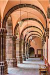 Colonnade with wooden benches at the Bella Artes School (Escuela de Bellas Artes) in San Miguel de Allende, Mexico