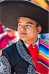 Close-up portrait of a male, Mexican dancer outdoors wearing traditional clothing in San Miguel de Allende, Mexico