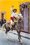 Mexican man on horse re-enacting rebelion during the historic horseback parade celebrating Mexican Independence Day in San Miguel de Allende, Mexico