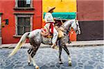 Mexican man on horse re-enacting rebelion during the historic horseback parade celebrating Mexican Independence Day in San Miguel de Allende, Mexico