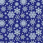 Winter pattern with snowflakes on a blue background. Vector, seamless texture