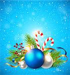 Christmas greeting card with green fir branch and decorations on a blue background.