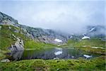 Beautiful mountain lake on the hiking route to Kjerag stone. Norway nature landscape.