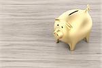 Golden piggy bank on wood background