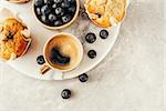 Cup of coffee and Homemade muffins. Food background with copy space for your text.