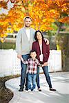Outdoor Portrait of Mixed Race Chinese and Caucasian Parents and Child.