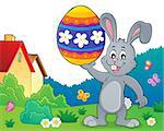 Bunny holding big Easter egg topic 2 - eps10 vector illustration.