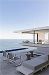 Modern, luxury home showcase exterior patio with ocean view