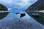 Boats at Santa Croce Lake, Alpago, Belluno Prealps, Veneto, Italy.