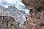 Climbers on the via ferrata Cengia Gabriella, Popera group, Giralba, Sexten Dolomites, Belluno, Veneto, Italy