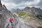 Sesto / Sexten, province of Bolzano, Dolomites, South Tyrol, Italy. Climber on the via ferrata "De Luca-Innerkofler" to the Mount Paterno