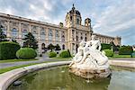 Vienna, Austria, Europe. Tritons and Naiads fountain on the Maria Theresa square with the Natural History Museum in the background