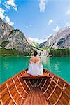 Lake Braies,Braies,Bolzano province,Trentino Alto Adige,Italy Girl admires the Braies Lake by boat.