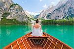 Lake Braies,Braies,Bolzano province,Trentino Alto Adige,Italy Girl admires the Braies Lake by boat.