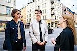 Young people talking in street