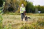 Portrait of volunteer with dog helping emergency services find missing people