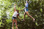 Two girls jumping