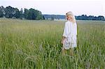 Woman walking in meadow