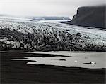 Glacier and rocks in Iceland in fog