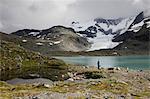 Tourist walking in Jotunheimen range