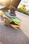 Feet of man on skateboard