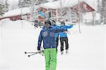 Men with skis walking up slope at Borgafjall