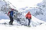 Two skiers on mountain in Piedmont, Italy