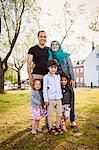 Family posing in park