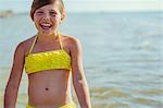 A smiling girl beside the sea