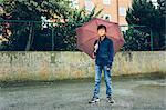 Portrait of boy holding umbrella